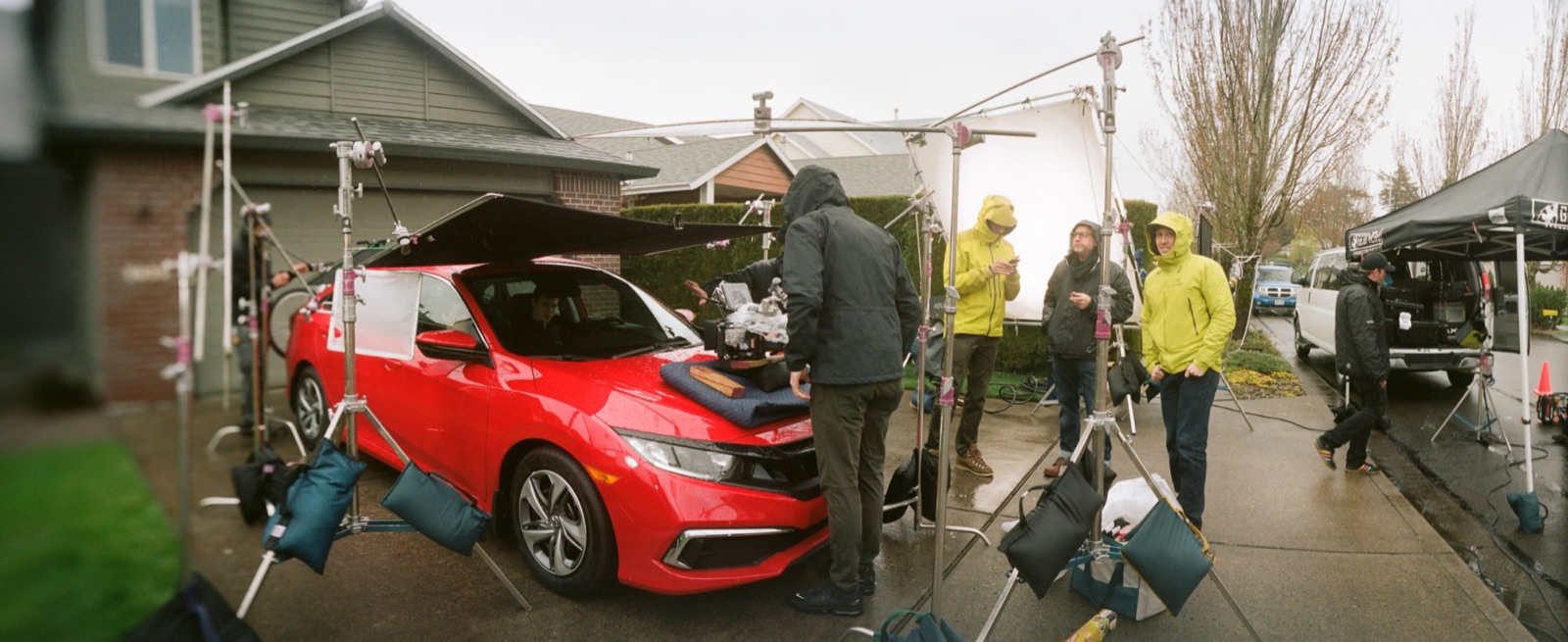 Civic: the camera on the hood for the driving interior, frames flagging the rain