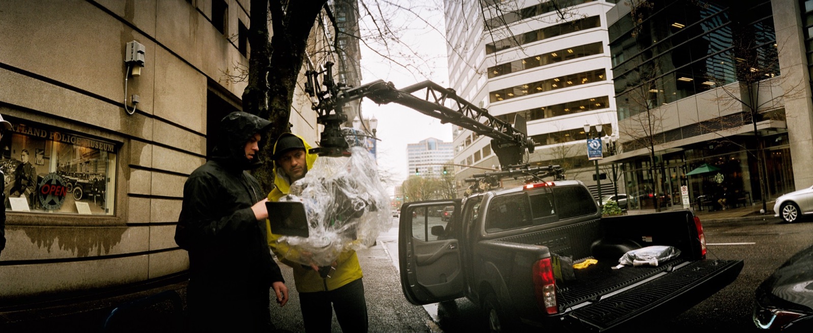 Civic: the crane truck outside the Portland Police Museum, camera bagged for the rain