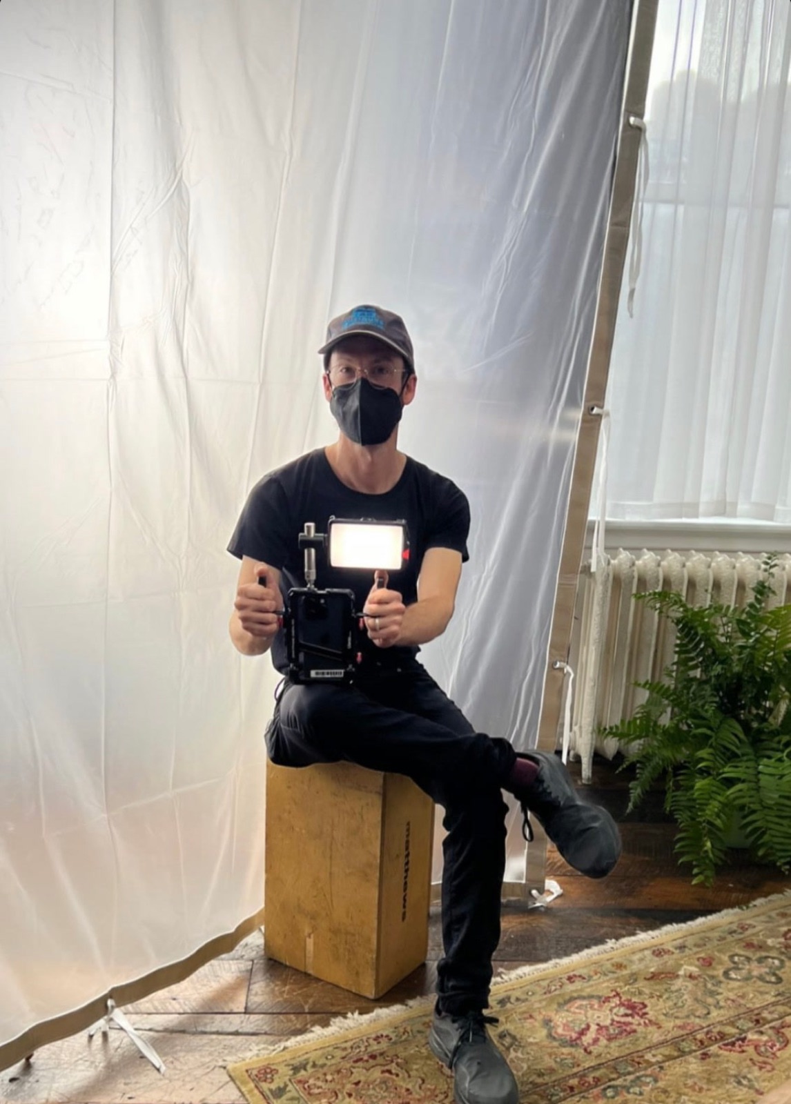Adam on an apple box with the phone rig and its light, Gary's Loft