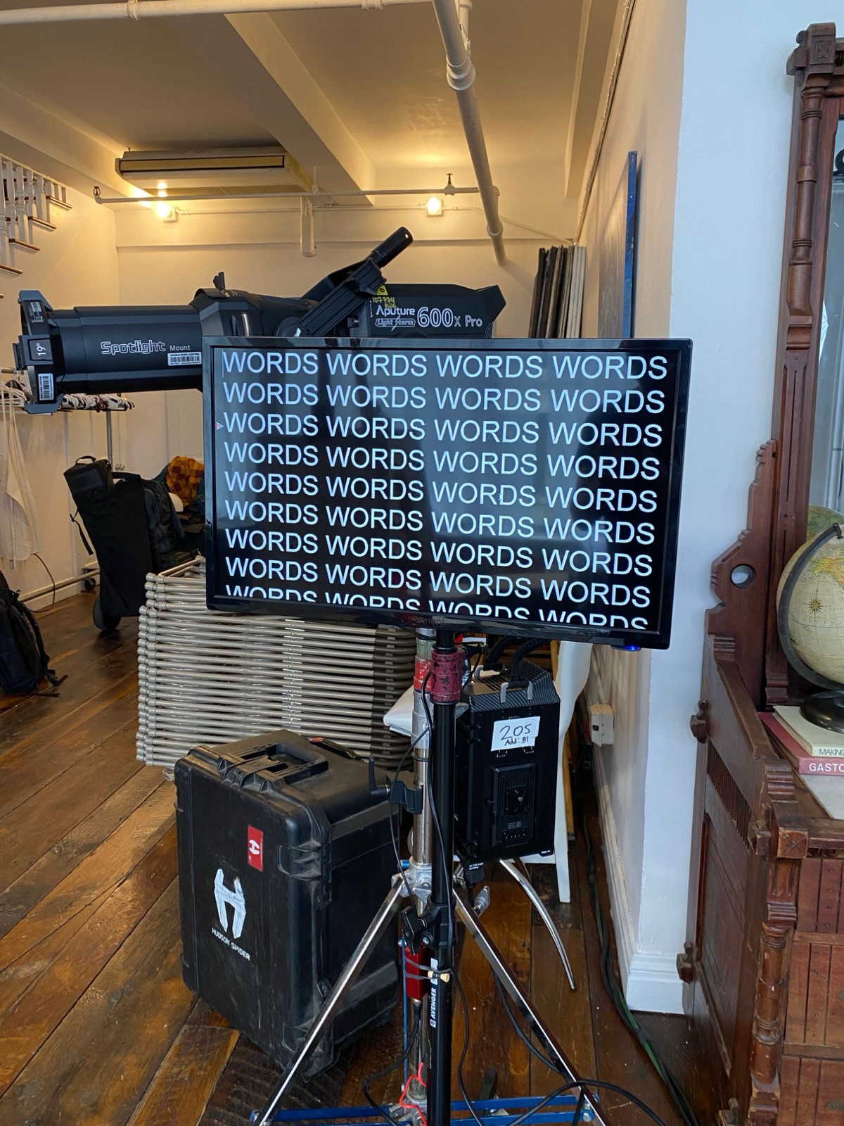 The prompter screen, placeholder text, in front of an Aputure 600x Pro with a Spotlight Mount