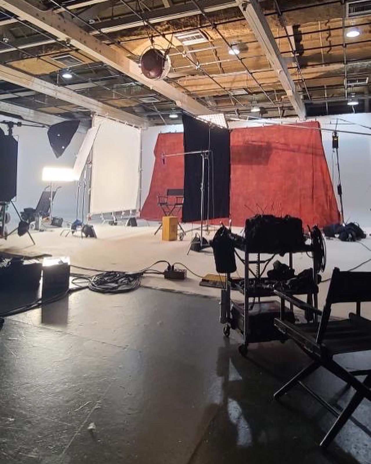 The EPK set at Highline Stage A: a painted backdrop, the Hudson Spider and frames around the chair